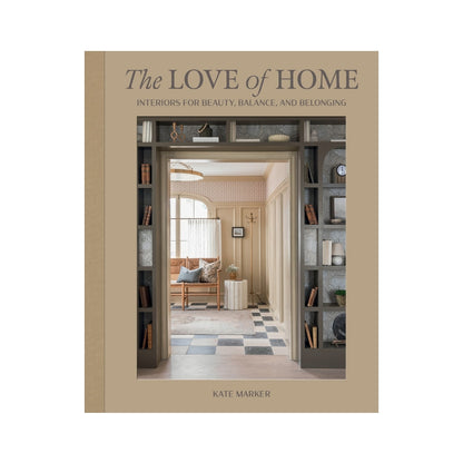 Hardcover book "The Love of Home" by Kate Marker, tan linen spine, interior design image on cover.