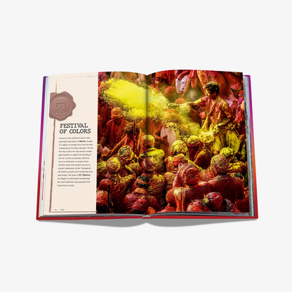 Open "Extraordinary Celebrations" book, showing a colorful Holi festival image and text on a matte laminated hardcover.