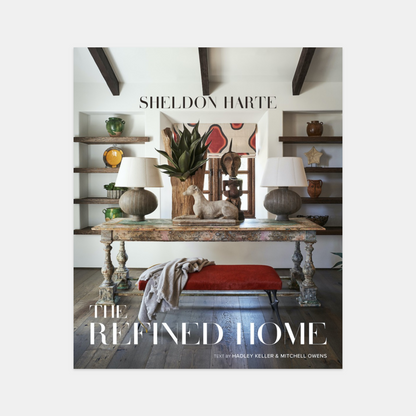 Hardcover book, "The Refined Home" by Sheldon Harte, featuring a rustic-chic interior design cover.