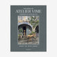 Hardcover book, "The World of Atelier Vime," gray linen cover with a courtyard scene.
