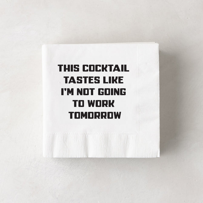 White paper cocktail napkins with "THIS COCKTAIL TASTES LIKE I'M NOT GOING TO WORK TOMORROW" in black text.