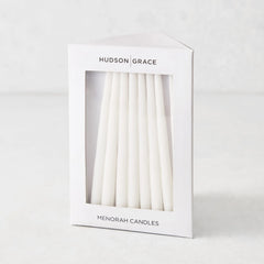 Box of 45 slender, white hand-dipped paraffin taper candles for a Hanukkah Menorah by Hudson Grace.