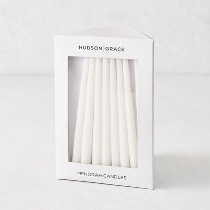 Box of 45 slender, white hand-dipped paraffin taper candles for a Hanukkah Menorah by Hudson Grace.