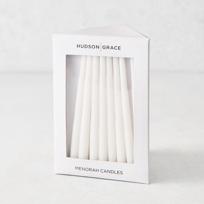 Box of 45 slender, white hand-dipped paraffin taper candles for a Hanukkah Menorah by Hudson Grace.