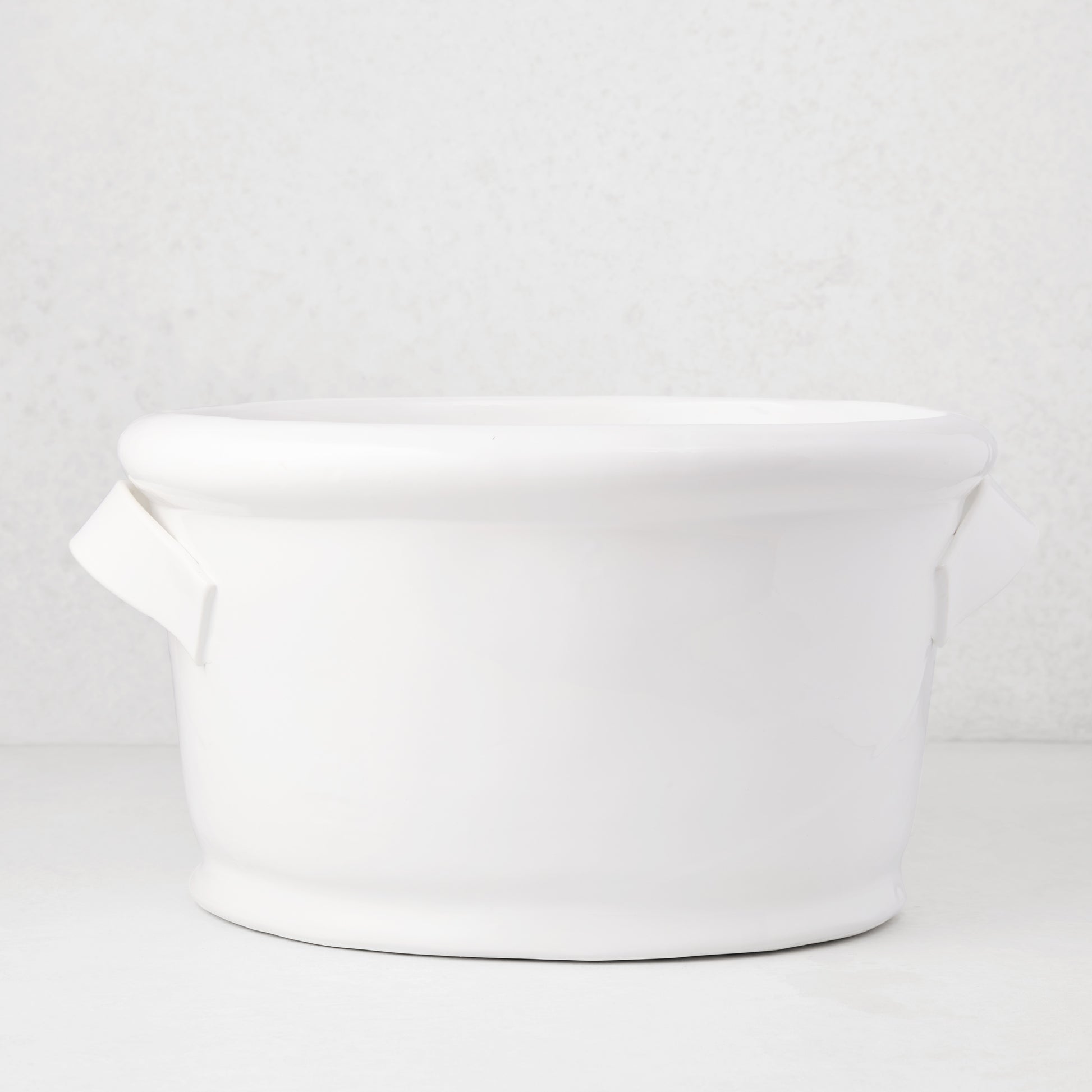 Tivoli white ceramic ice bucket with two simple handles, 17.3"L x 14"W x 9.4"H.