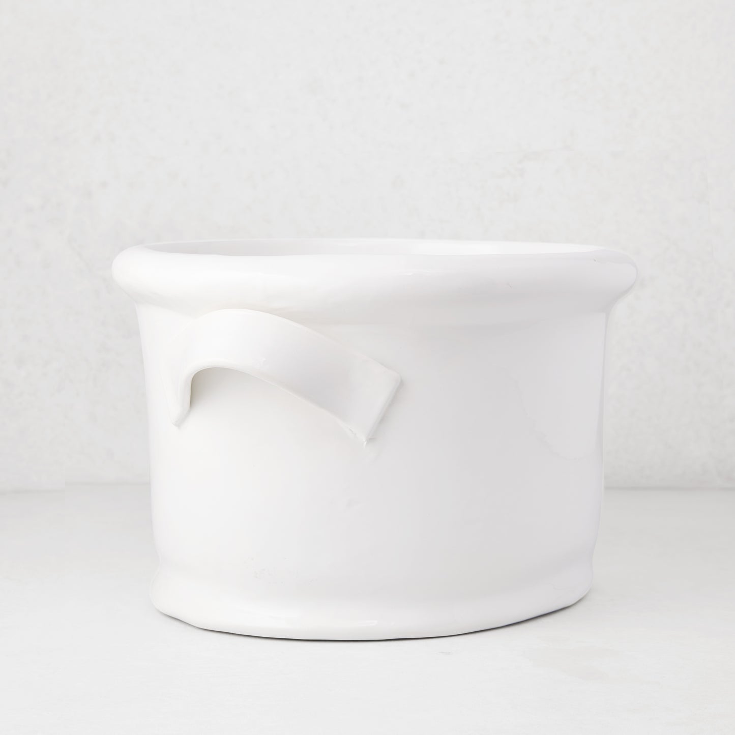 Tivoli white ceramic ice bucket with two simple handles, 17.3"L x 14"W x 9.4"H.