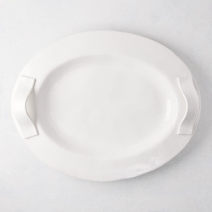 Tivoli white ceramic oval serving platter with two elegant handles.