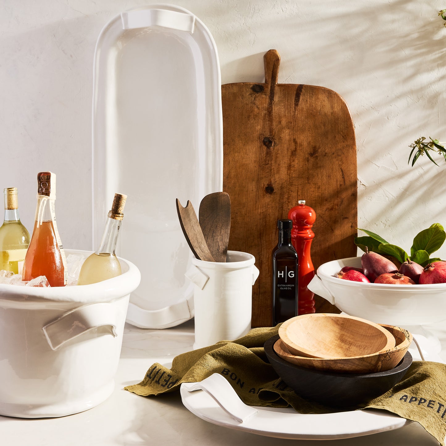 White Tivoli ceramic oversized 30-inch long serving platter with handles, surrounded by kitchenware.