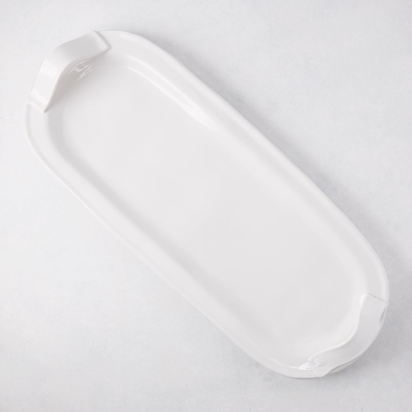 Tivoli white ceramic oversized long serving platter with two elegant handles.