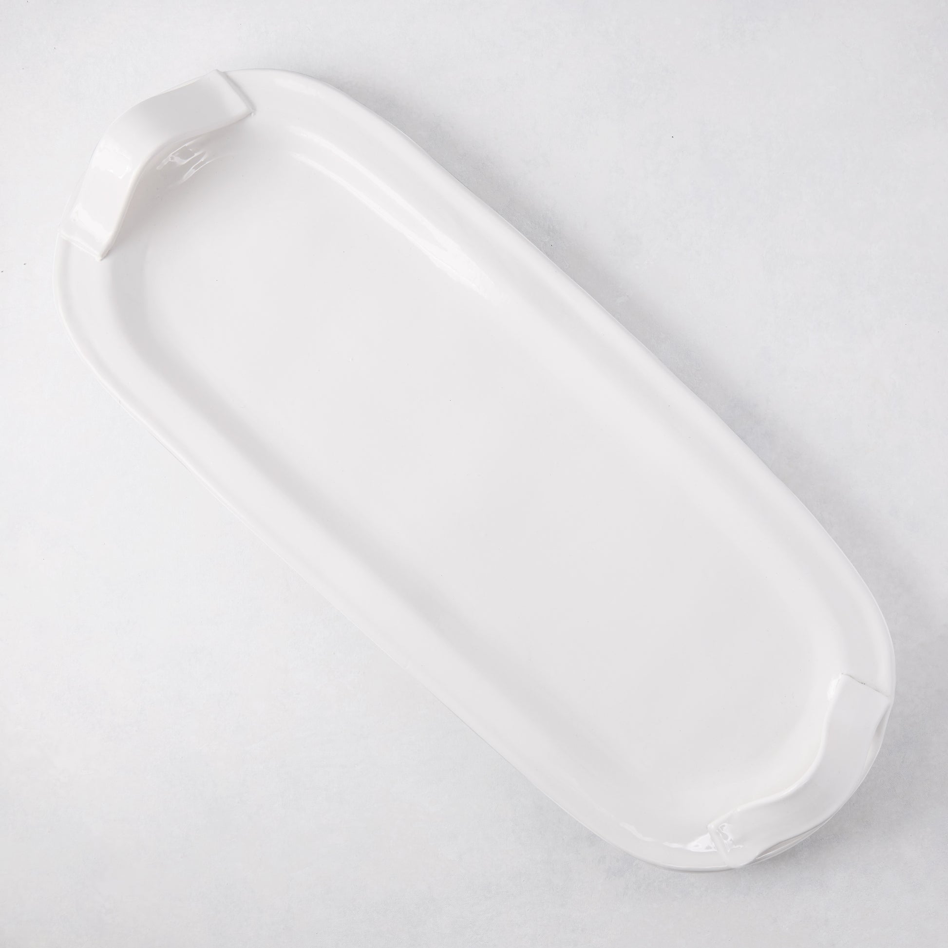 Tivoli white ceramic oversized long serving platter with two elegant handles.