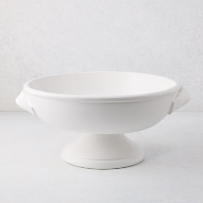 Tivoli white ceramic pedestal serve bowl with two handles, 15.3"L x 13.3"W x 6.7"H.