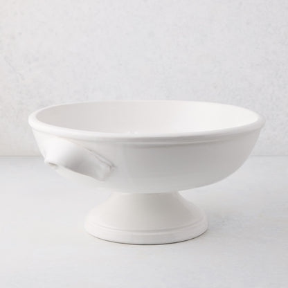 Tivoli white ceramic pedestal serve bowl with two handles, 15.3"L x 13.3"W x 6.7"H.