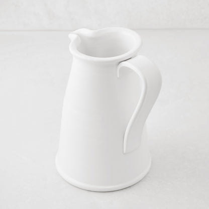 Tivoli white ceramic pitcher with flat handle, Italian craftsmanship.