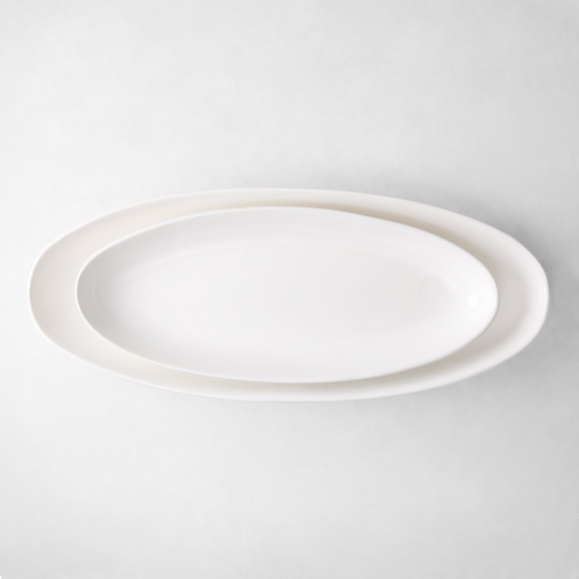 Torino Small Oval Ceramic Serving Platter, white, 21.5"L x 8.75"W, simple, elegant design.