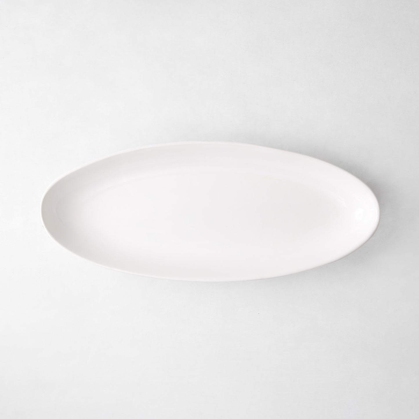 Torino Small Oval Ceramic Serving Platter, thick white glaze, 21.5"L x 8.75"W.