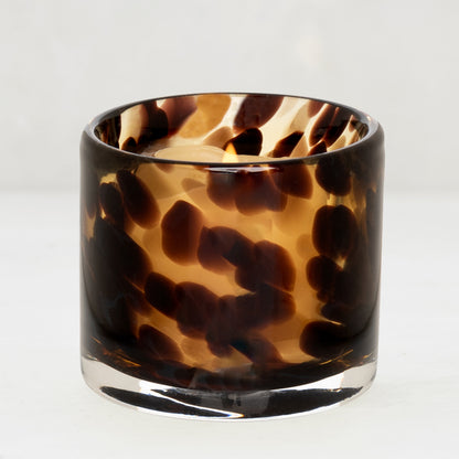 Tortoise votive glass candle holder with a lit tealight, 2.75"Dia x 2.75"H.