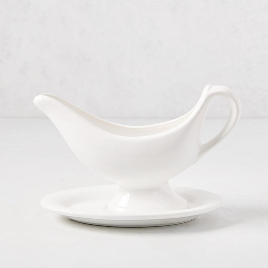 Toscana white ceramic sauce/gravy boat with integrated handle and attached oval plate.