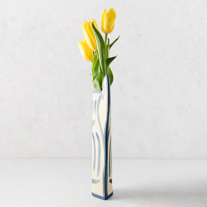 Trompe-L'oeil Floral N2 Krater stoneware vase with blue hand-painted detailing, holding yellow tulips.