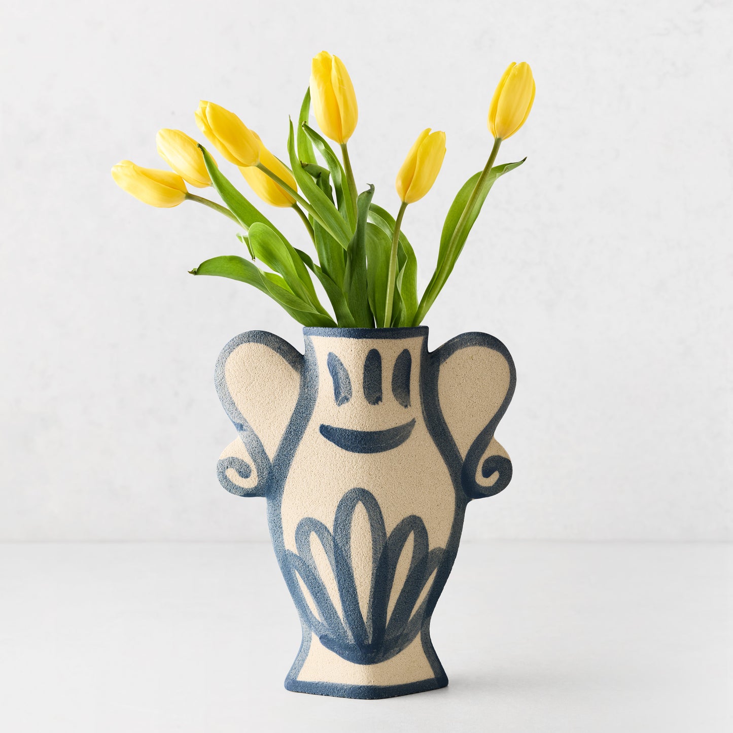 Trompe-L'oeil Floral N2 Krater stoneware vase, raw texture, blue hand-painted Greek-inspired details, yellow tulips.