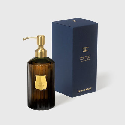 Trudon Medie 350ml liquid hand soap in a ribbed amber glass bottle with a gold pump and dark blue box.