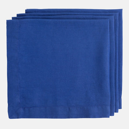 Stack of three Ultramarine HG Signature hand-dyed 22" square linen napkins with mitered corners.