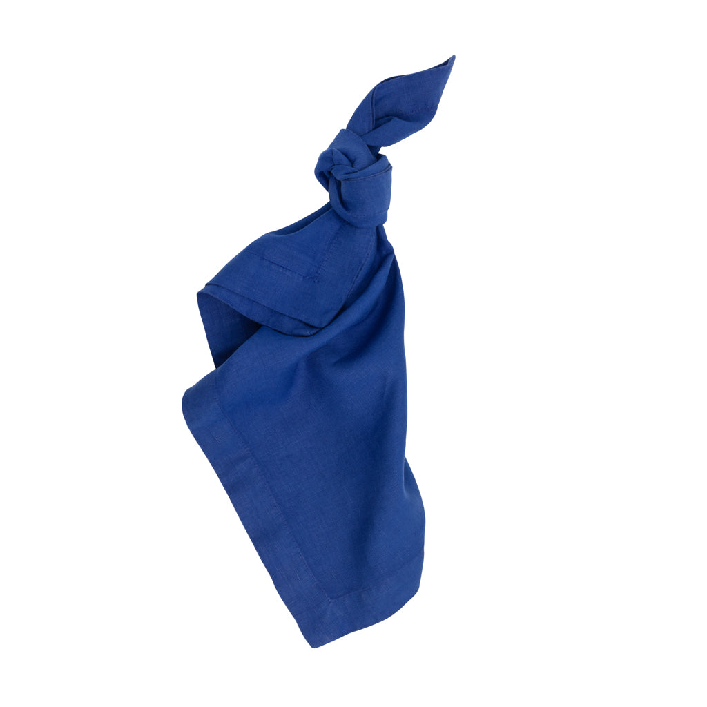Ultramarine HG Signature hand-dyed 22" square linen napkin, tied in a knot.