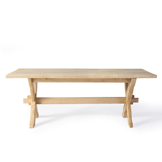 Vintage bleached English oak trestle farm table with a thick plank top and natural wood grain finish.