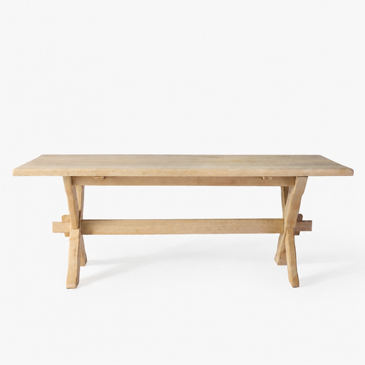 Vintage bleached English oak trestle farm table with a natural wood grain finish and classic cross-base design.