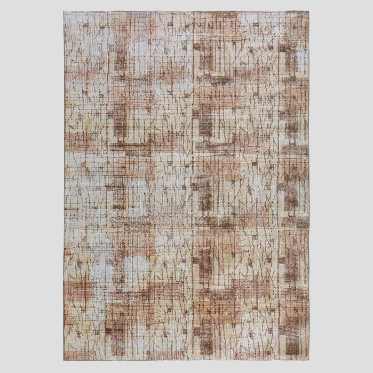 Vintage brown patterned Turkish wool rug, 4'9"x7', with natural fading and low pile.