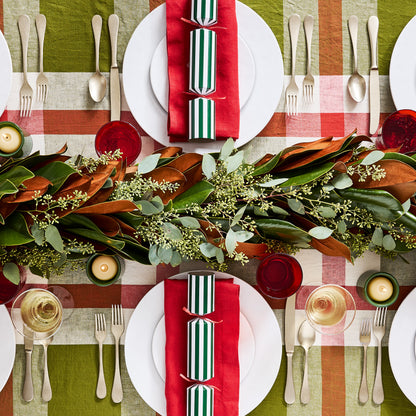 Vintage Champagne 5-piece flatware set on a holiday table with red and green plaid tablecloth.