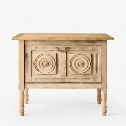 Vintage bleached oak bar console with carved circular door panels and a brass drop pull handle on turned legs.