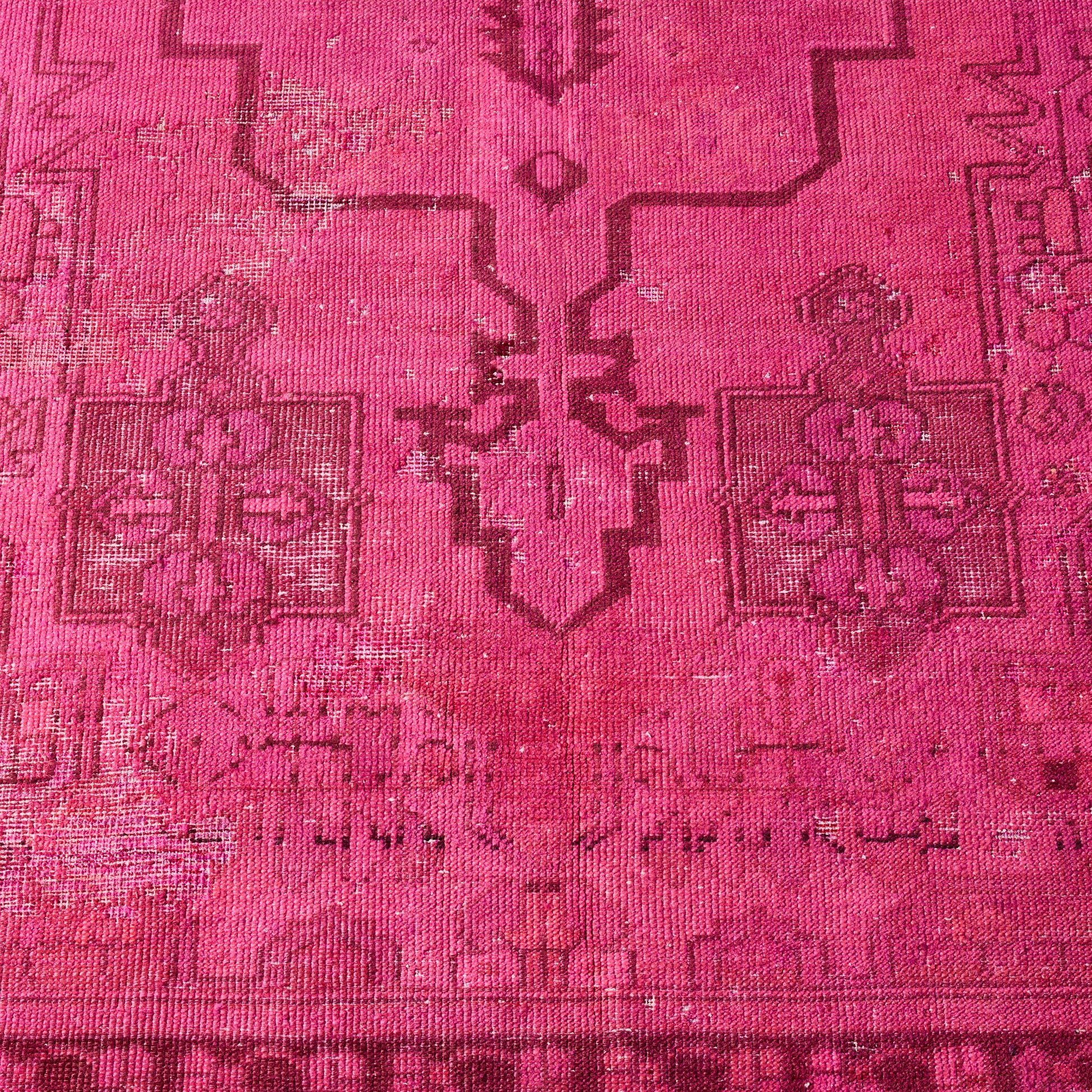 Vintage hot pink wool Turkish rug with faded geometric patterns and low pile texture, 4'3 x 8'4.
