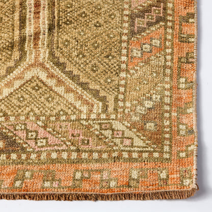 Vintage Linnea wool runner rug in faded brown and orange with a low-pile, handcrafted geometric pattern.