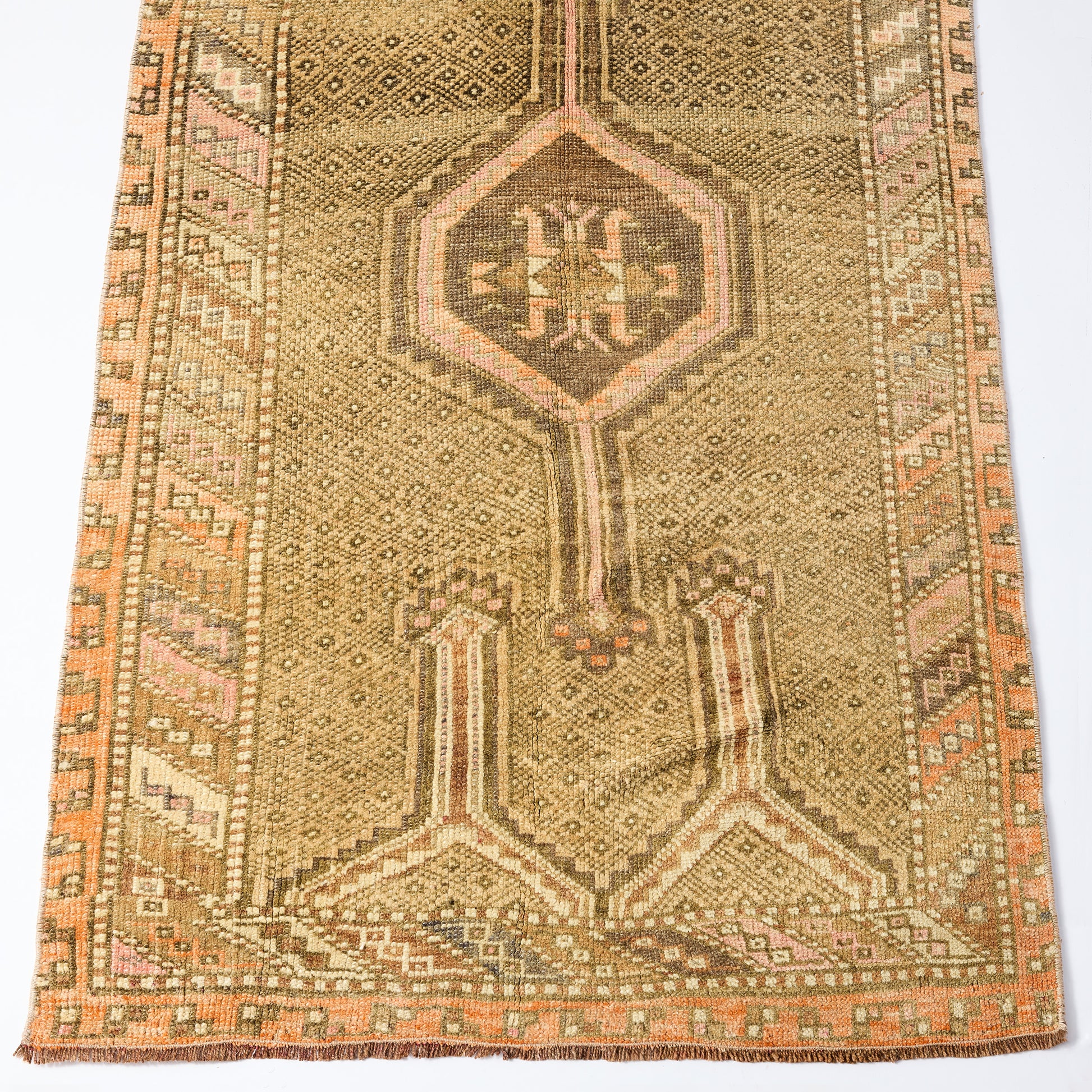 Vintage 3'2 x 5'6 wool runner rug with faded brown and pink geometric patterns and traditional Turkish design.