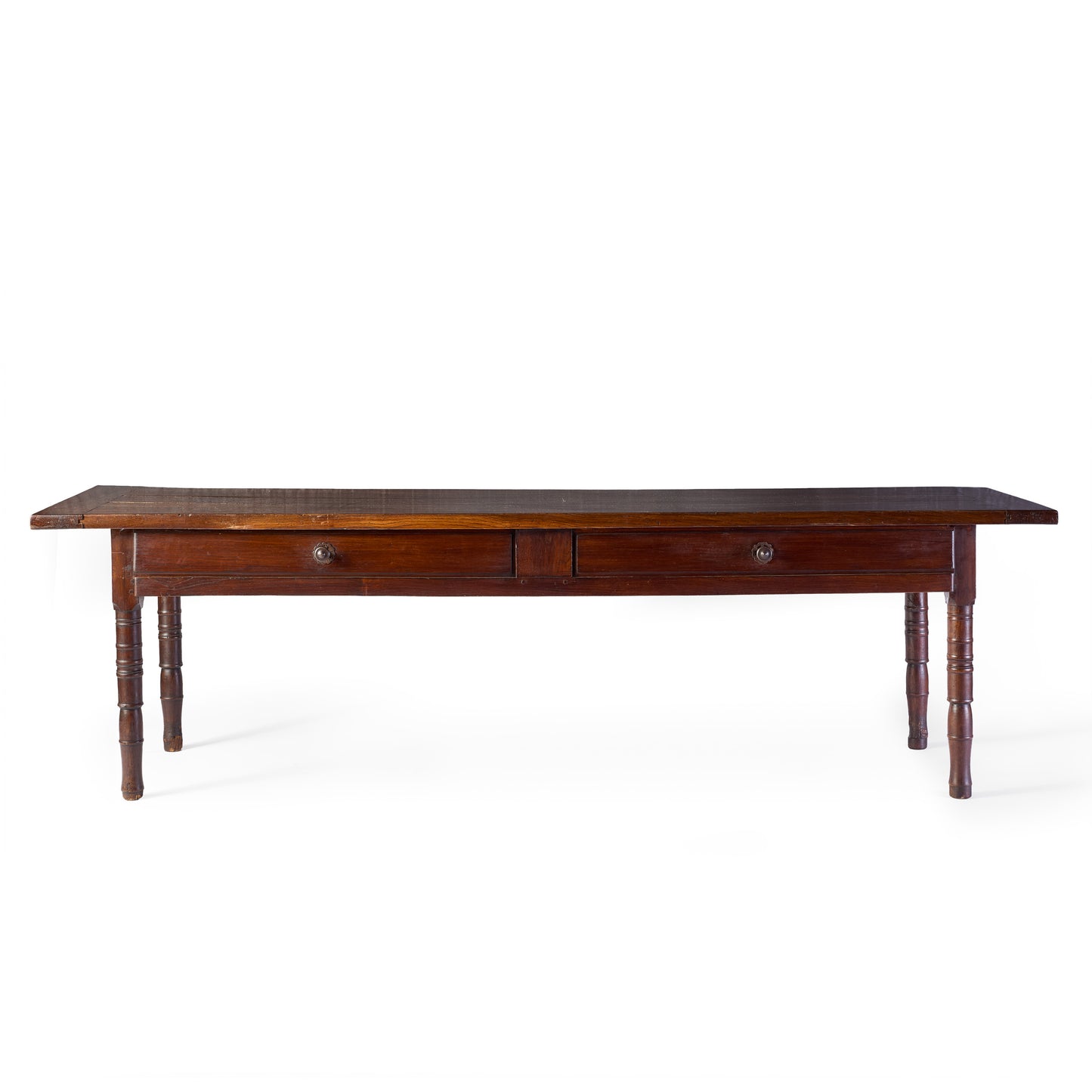 Vintage mahogany kitchen table with two storage drawers and slender turned legs on a white background.