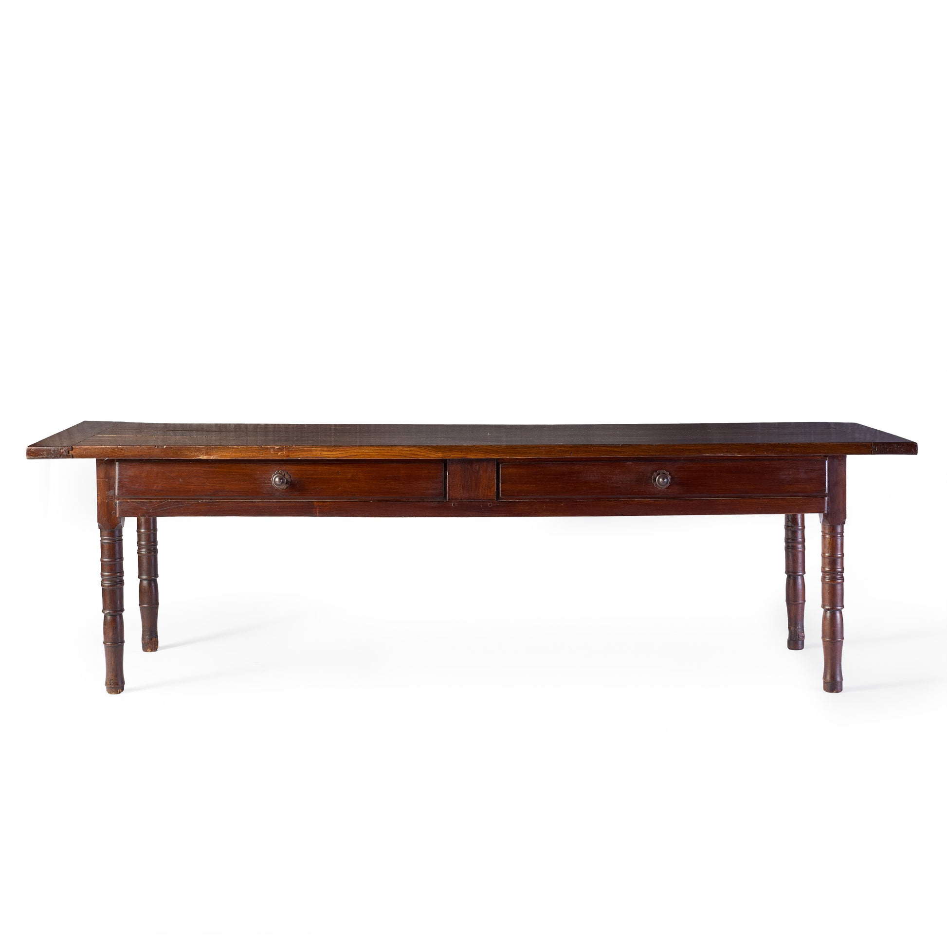 Vintage mahogany kitchen table with two storage drawers and slender turned legs on a white background.
