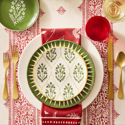 Vintage Oro gold stainless steel 5-piece flatware set with a matte finish arranged on a festive holiday table setting.