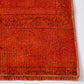 Close-up of a vintage red wool runner rug with a low-pile, handcrafted texture and stitched edge detail.