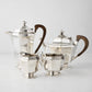 Vintage silverplate Audrey 4-piece tea set with wood handles, including teapot, coffee pot, sugar, and creamer.