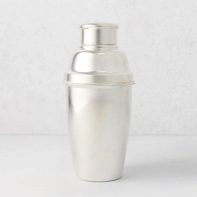 Vintage silverplate Aveline cocktail shaker with a ribbed band, shiny finish.