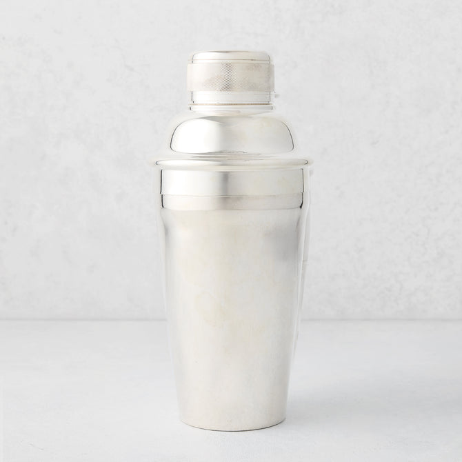 Vintage silverplate Carrie cocktail shaker with ribbed cap.