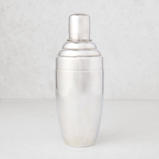 Vintage silverplate Corinna cocktail shaker with a sleek, tiered design.