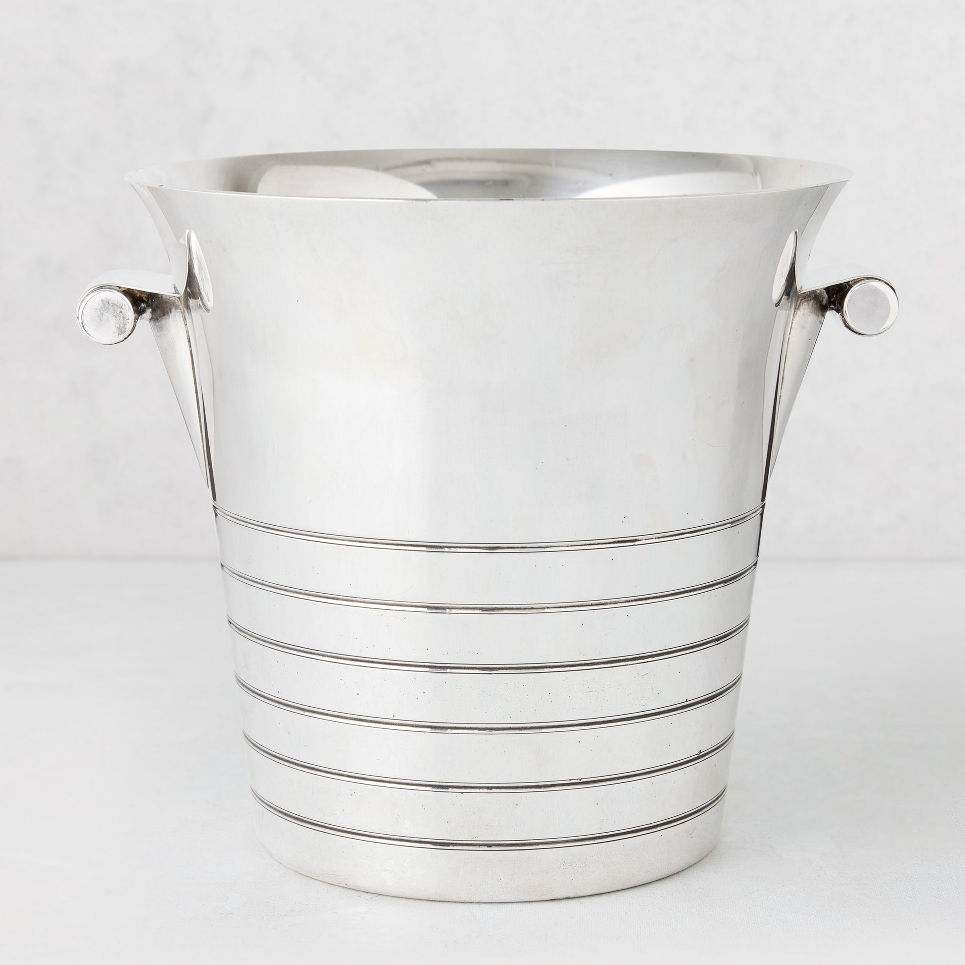 Vintage silverplate Deco lined champagne bucket with two handles.