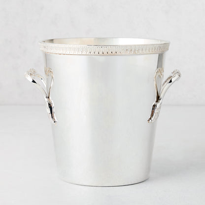 Vintage silverplate Delaney ice bucket with decorative border edge and ornate handles.