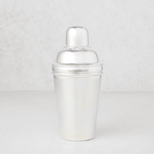 Vintage silverplate Estrella cocktail shaker, shiny, three-piece design.