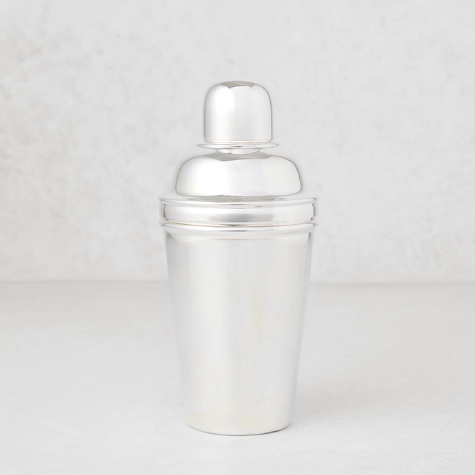 Vintage silverplate Estrella cocktail shaker, shiny, three-piece design.