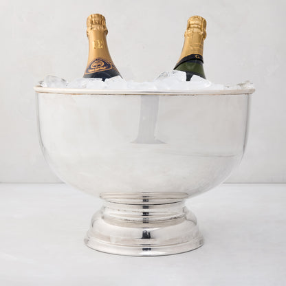 Vintage silverplate footed punch bowl, 12" diameter, holding two champagne bottles on ice.