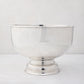 Vintage silverplate footed punch bowl, 12" diameter, with a polished, reflective finish.
