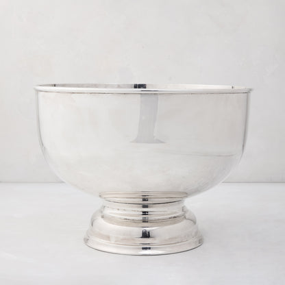 Vintage silverplate footed punch bowl, 12" diameter, with a polished, reflective finish.