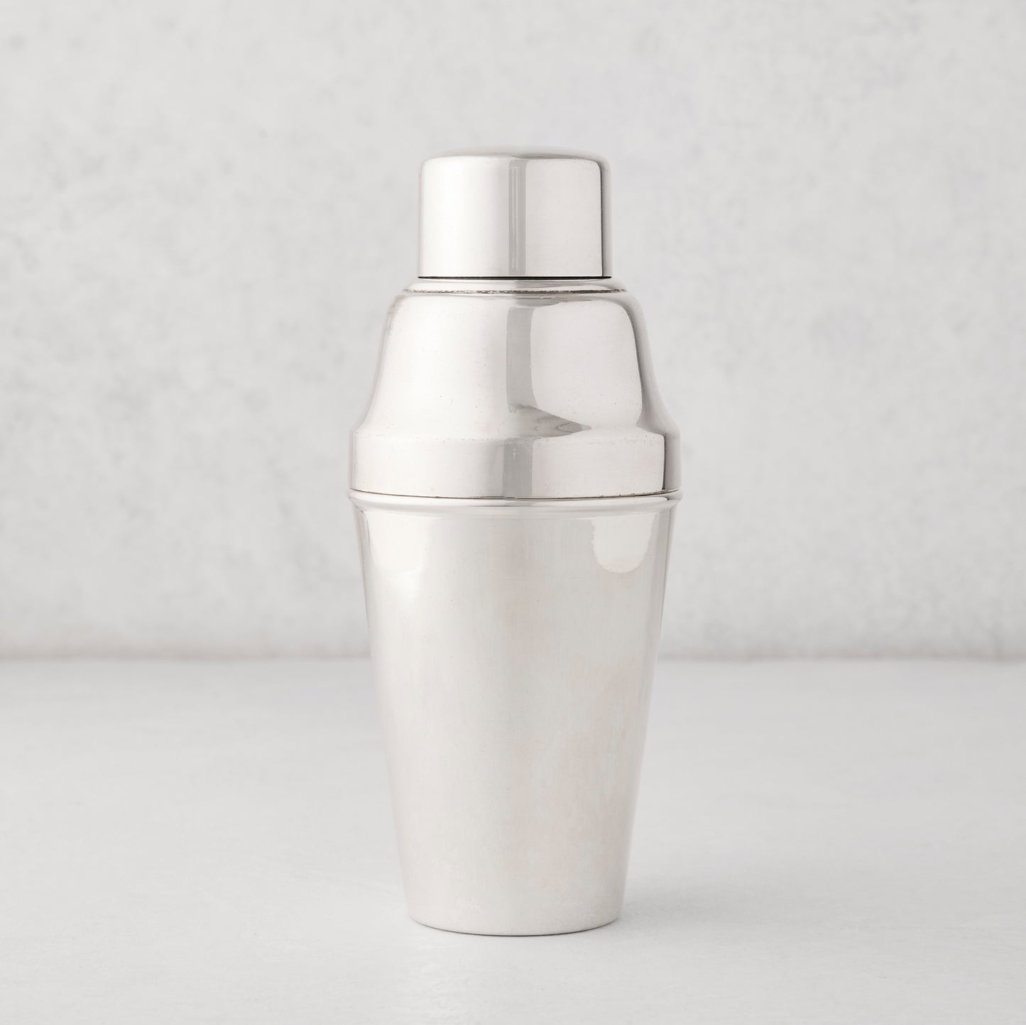 Vintage silverplate Hallie cocktail shaker with a shiny, smooth finish.